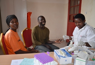 Uwamwiza Victoria and her husband Iyiragiye Jeremie test for HIV/AIDS before pregnancy test with help of Midwife Nyirarukundo Jeanne