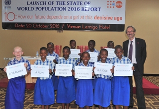 10-year old girls show their dreams during an interactive session at the launch of the State of the World Population report.