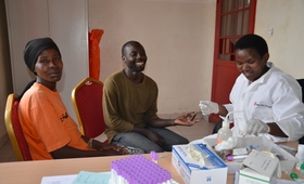 Uwamwiza Victoria and her husband Iyiragiye Jeremie test for HIV/AIDS before pregnancy test with help of Midwife Nyirarukundo Jeanne