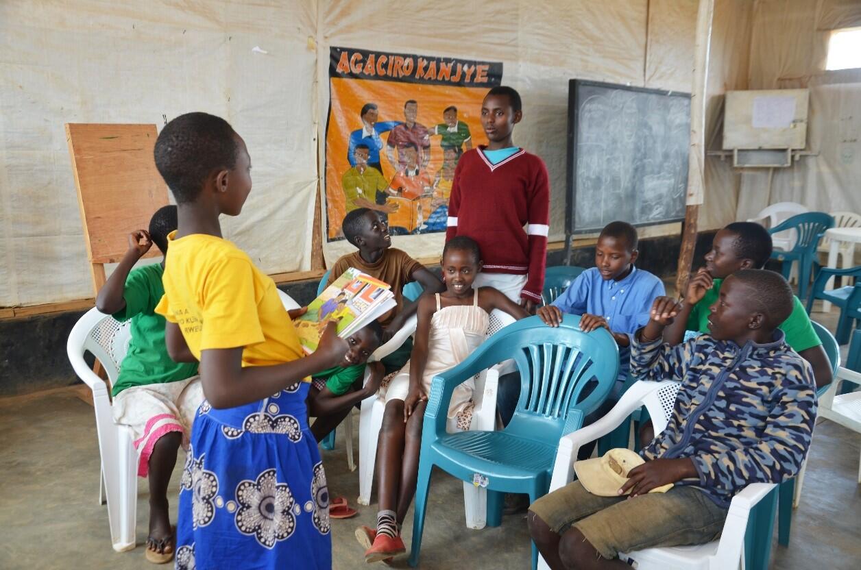  Children aged 10 – 13 in a discussion to share what they’ve learnt after SRH session with a Midwife  