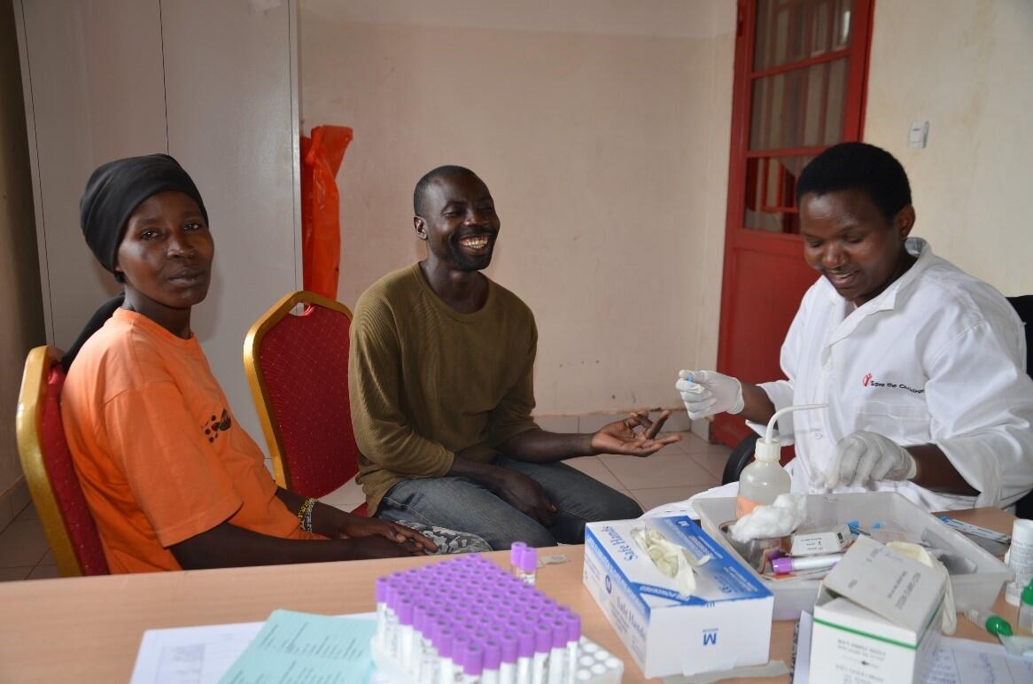 Uwamwiza Victoria and her husband Iyiragiye Jeremie test for HIV/AIDS before pregnancy test with help of Midwife Nyirarukundo Jeanne