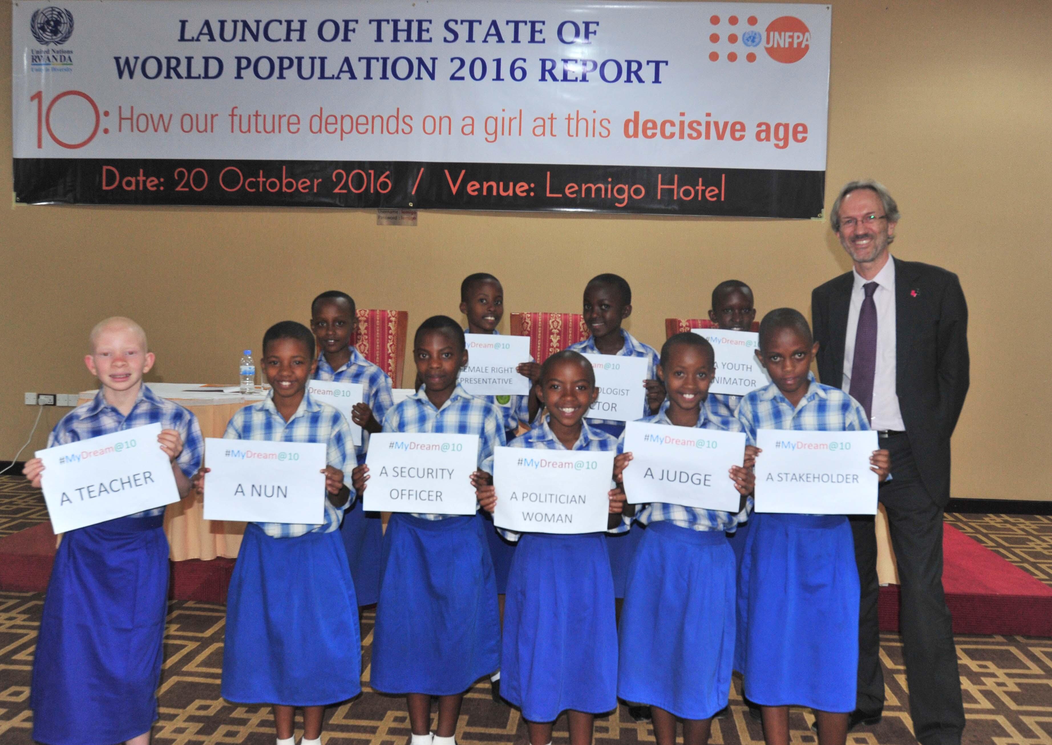 10-year old girls show their dreams during an interactive session at the launch of the State of the World Population report.