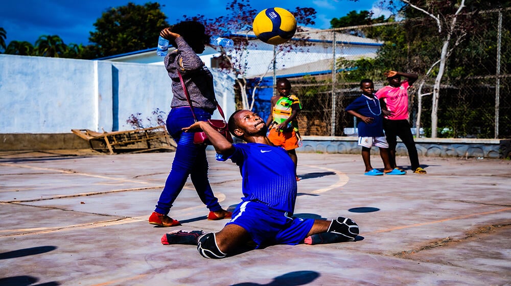 A Person with disability playing sitting volleyball during the celebration of IDPD in Rusizi District. Photo by UNFPA Rwanda